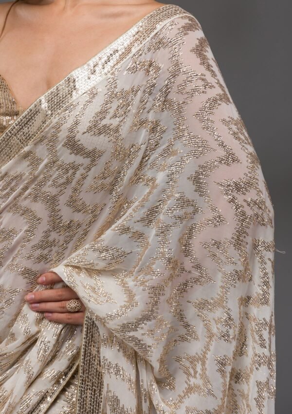 Stunning Off-White Georgette Saree Adorned with Sparkling Sequins - Image 7