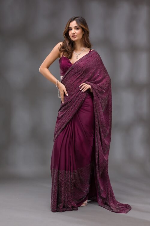 Elegantly Crafted Wine Swarovski Crepe Designer Saree